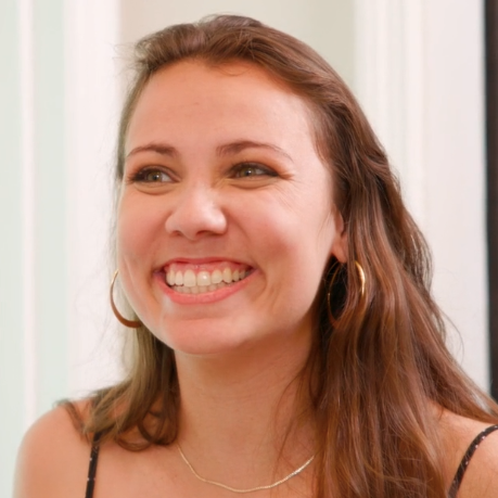 How often should you microneedle affecting a woman looking in the mirror loving her new look